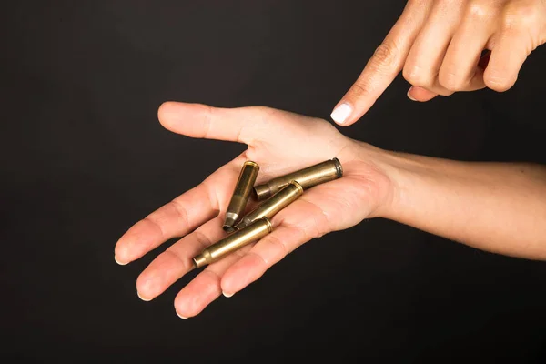 Female hand with bullets — Stock Photo, Image