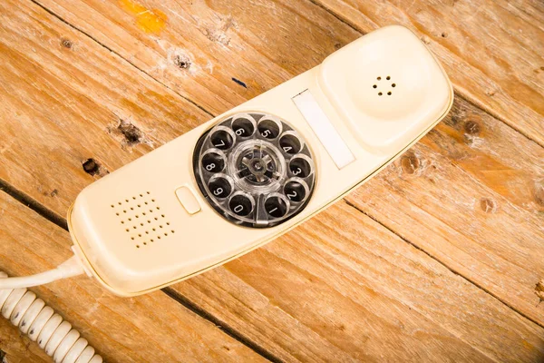 Old phone with its dial incorporated in the handset