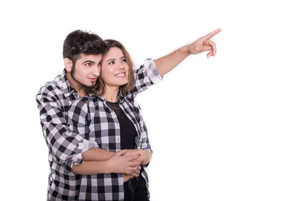 Boy pointing up showing something to girl isolated — Stock Photo, Image