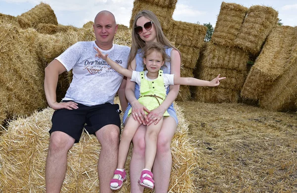 Family photo shoot in the hayloft, village Maryanovka Ukraine.