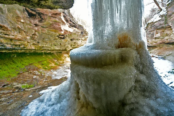 Winter landscapes of a waterfall frozen in ice.