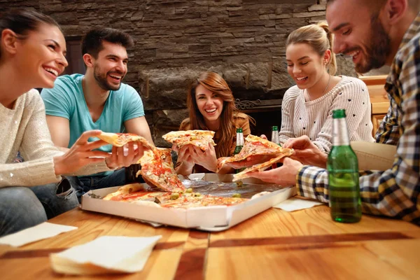Smiling Group Young People Eating Big Pizza Together — стоковое фото