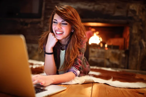 Young Woman Working Laptop While Lying Floor Fireplace — Stock Photo, Image