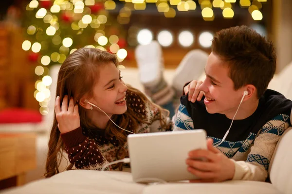 Cute Brother Sister Headphones Lying Using Tablet Smiling — Stock Photo, Image