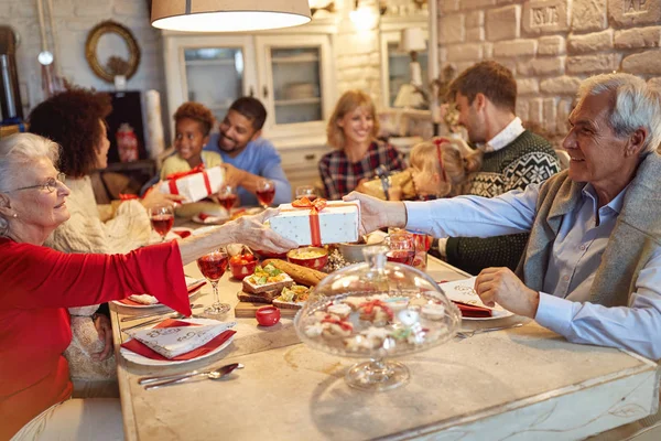 Happy Family Friends Enjoy Christmas Dinner Exchange Gifts Together — Stock Photo, Image
