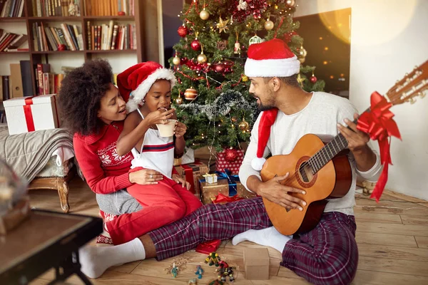 Happy Family Sitting Floor Together Listening Guitar Songs Home Christmas — Stock Photo, Image