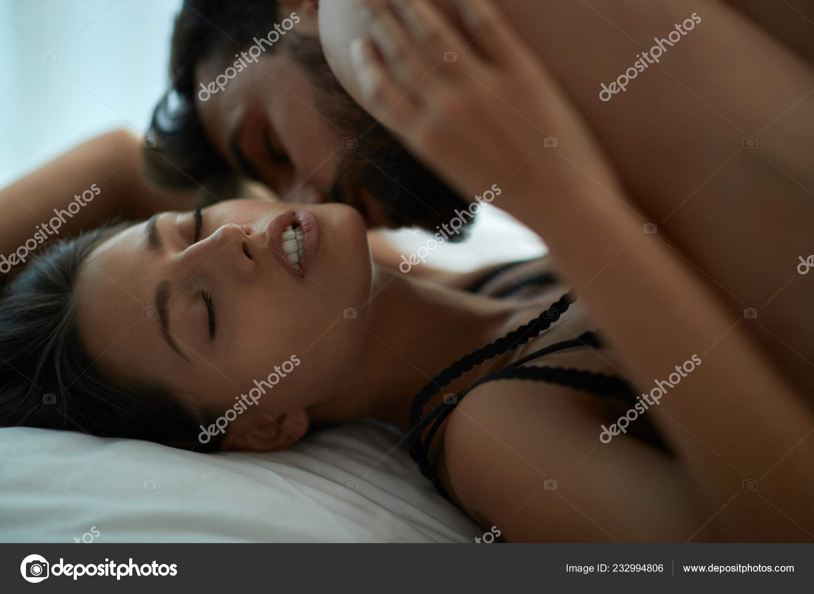 Young Couple Man Woman Making Love Having Passionate Sex Bed Stock Photo by ©luckybusiness 232994806