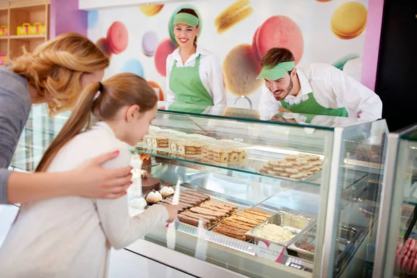 Girl Shows Cookies Show Glass Sellers Bakery — Stock Photo, Image