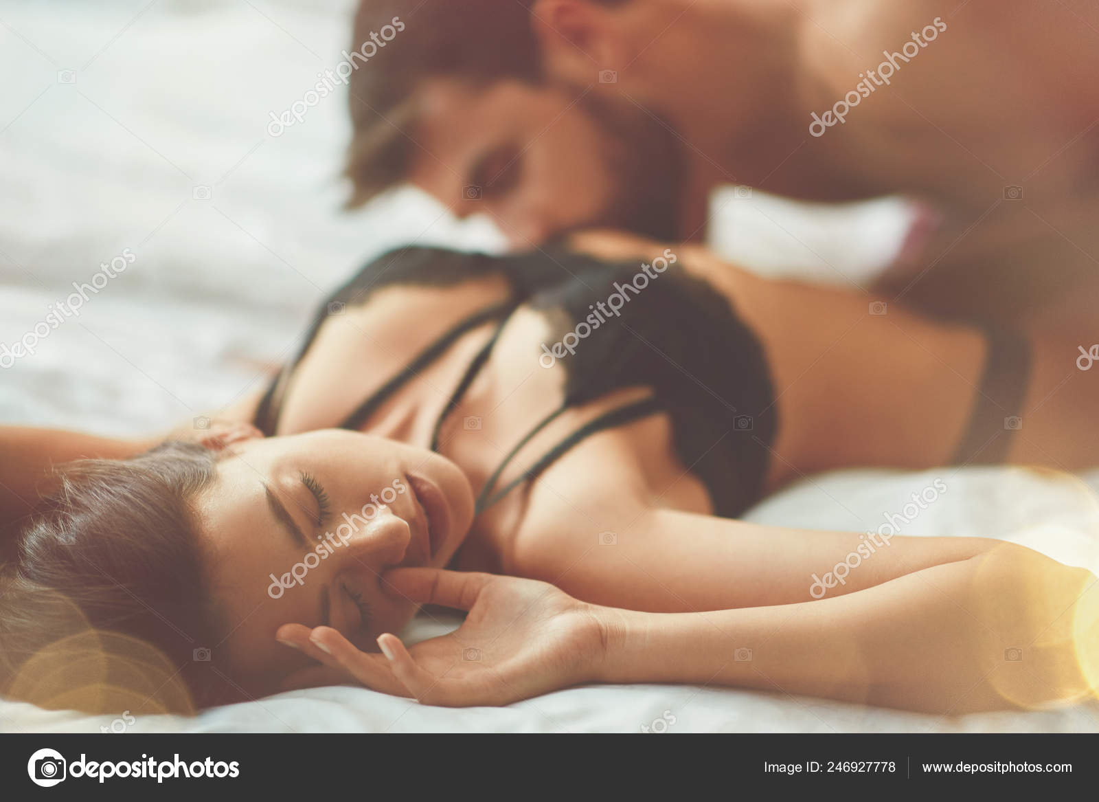 Man And Woman Making Love In Bed