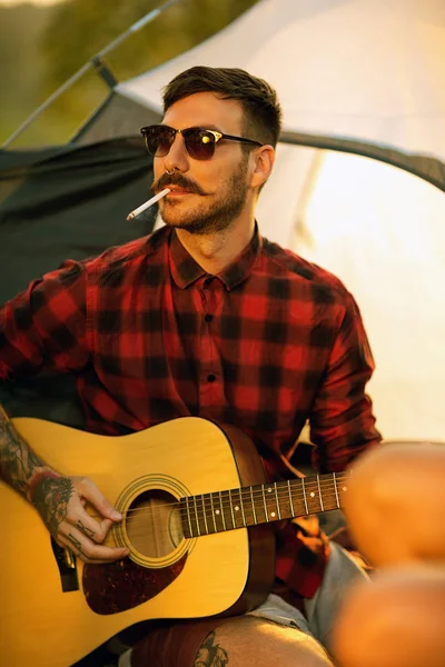 Portrait of hipster man with guitar — Stock Photo, Image
