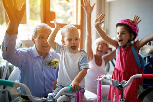 Grandparents buying new bicycle for little boy — Stock Photo, Image