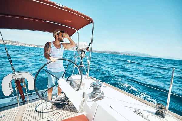 Happy man on a yacht enjoy on vacation
