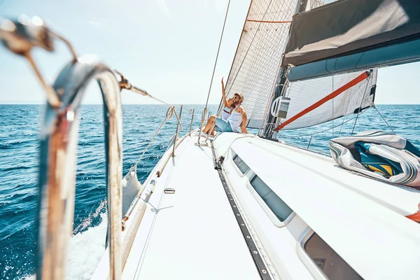 Couple spending happy time on a yacht at se Royalty Free Stock Images