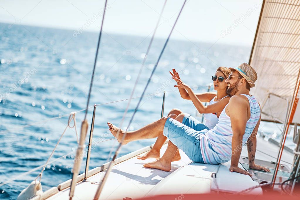 Happy lovers relaxing on a luxury yacht. couple on cruise