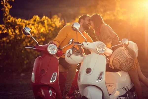 Loving man and woman on scooter enjoying in romantic road trip — Stock Photo, Image