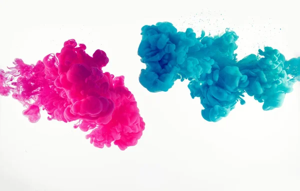 Explosion of blue and mangenta color in water — Stock Photo, Image