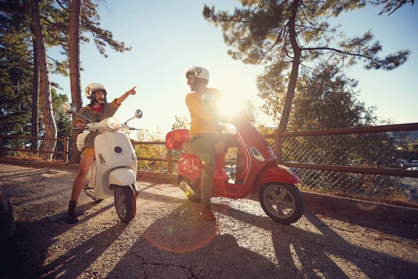 Cheerful woman and man traveling on motorcycle and looking at Italy on journey — Stock Photo, Image