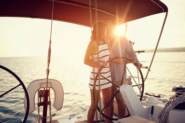 Romantic couple on the luxury boat together enjoy at sunse — Stock Photo, Image