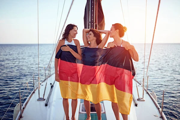 Happy girls have party on the yacht - Germany flay