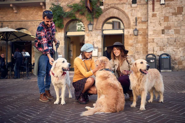 Happy friends with dog laughing and having fun on journey