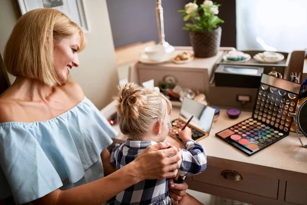 Female kid is amusing with make up — Stock Photo, Image