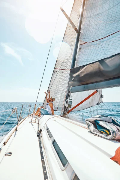 Happy man and woman in love on a yacht in the summer Stock Photo