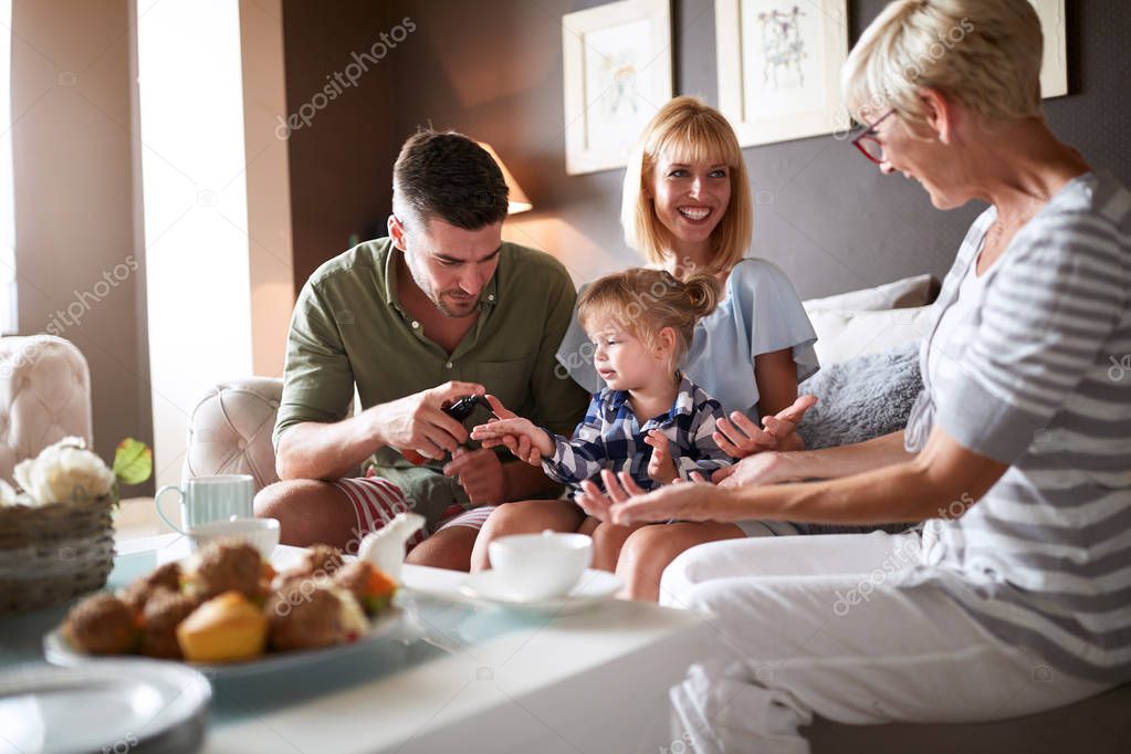 Parents with kid visiting grandmother