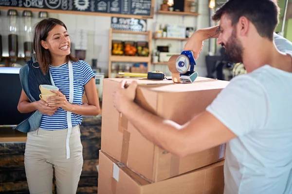 Business partners working together at their coffee shop — Stock Photo, Image