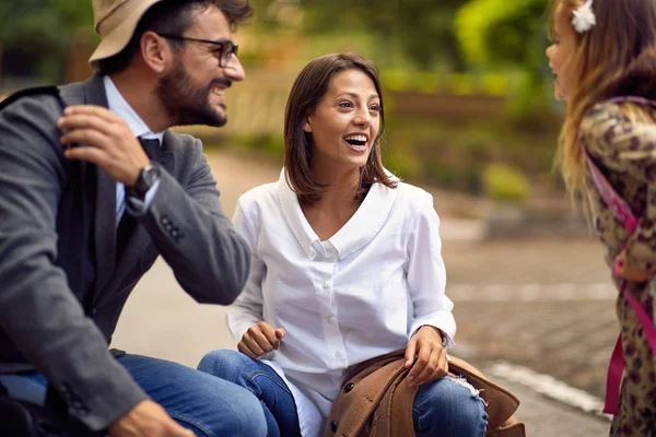 First day at school, parents and girl playing in front of school — Stock Photo, Image