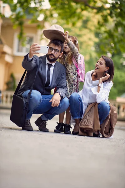 First day at school, parents and girl making a photo in front of — Stock Photo, Image