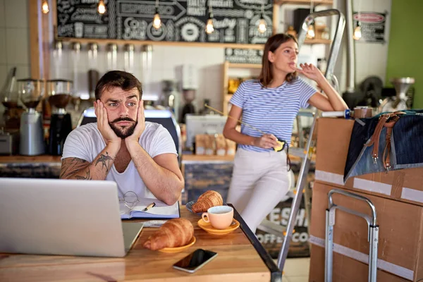 Upset man cafe owner working on laptop ready to open their cafe. — Stock Photo, Image