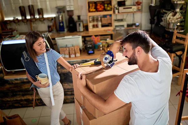 Business people working together at their coffee shop — Stock Photo, Image