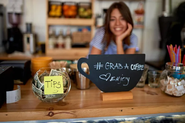 Tips jar and grab sign for coffee at new cafe — Stock Photo, Image