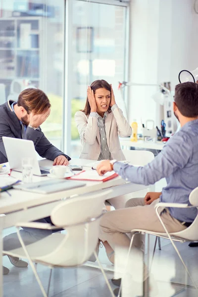 Stressed business people at office