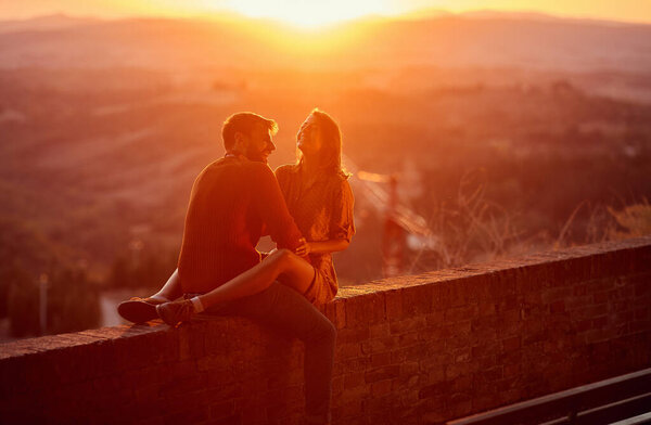 Lovers. romantic at sunset. Couple smiling and enjoying together