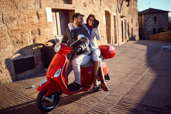 Man and woman having fun on moto scooters. couple riding motor s — Stock Photo, Image