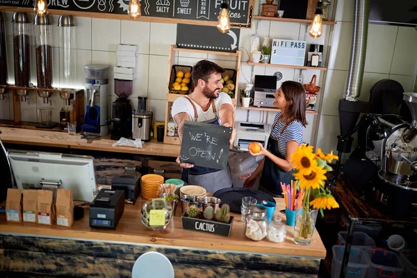 Coffee business concept.owner of a cafe showing open sign. — Stock Photo, Image