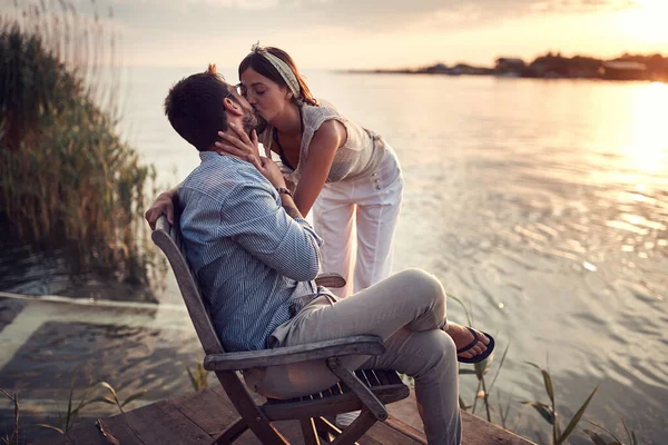 Young Beautiful Caucasian Female Kissing Man Riverside Sunset — Stock Photo, Image