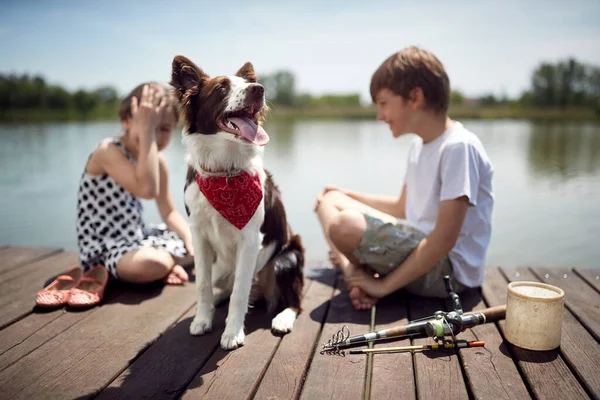 Dog Red Scarf His Owners Background Children Talking Smiling — Stock Photo, Image