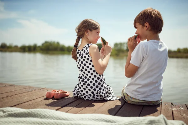 Brother Sister Sitting Dock Eating Watermelon Sunny Day — Stock Photo, Image