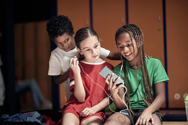 Little Soccer Player Showing Cell Phone Content His Teammates Locker — Stock Photo, Image