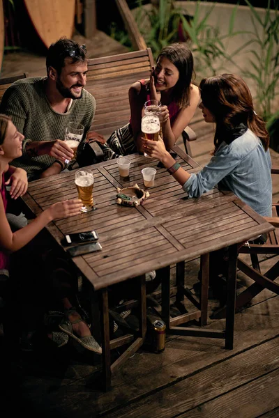 group of caucasian friends having drink outdoor