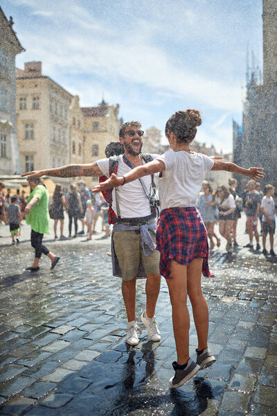 Happy Couple traveling together and enjoying at raining day.