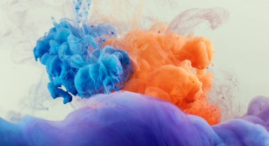 beautiful detail from colorful watercolor ink splash explosion . Abstract background concept clipart