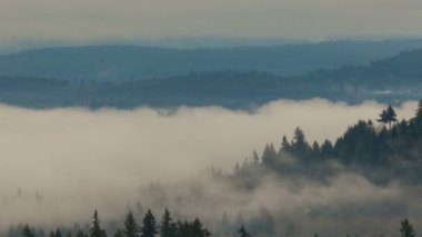 Time lapse of low clouds and fog over Happy Valley OR landscape 4k UHD video USA