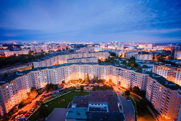 Residential area view at night. Blocks of flats and city lights at sunset — Stock Photo, Image