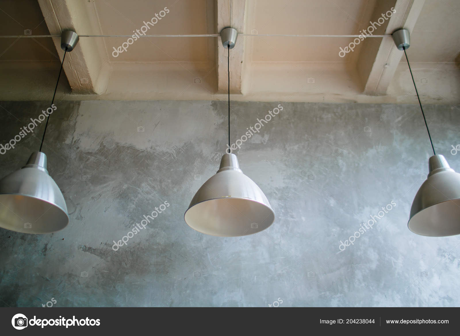 Three Modern Lamps Concrete Ceiling White Silver Lamps Close