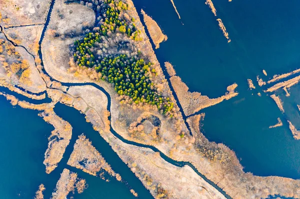 Ecological problem concept. Floods surrounding dry lands aerial