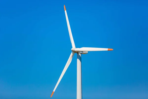 Wind turbine close up. Propeller in blue background. Renewable energy concept — Stock Photo, Image