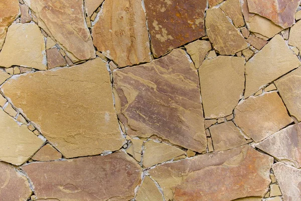 Age concept. Cracked stone close up texture. Rock material in decor